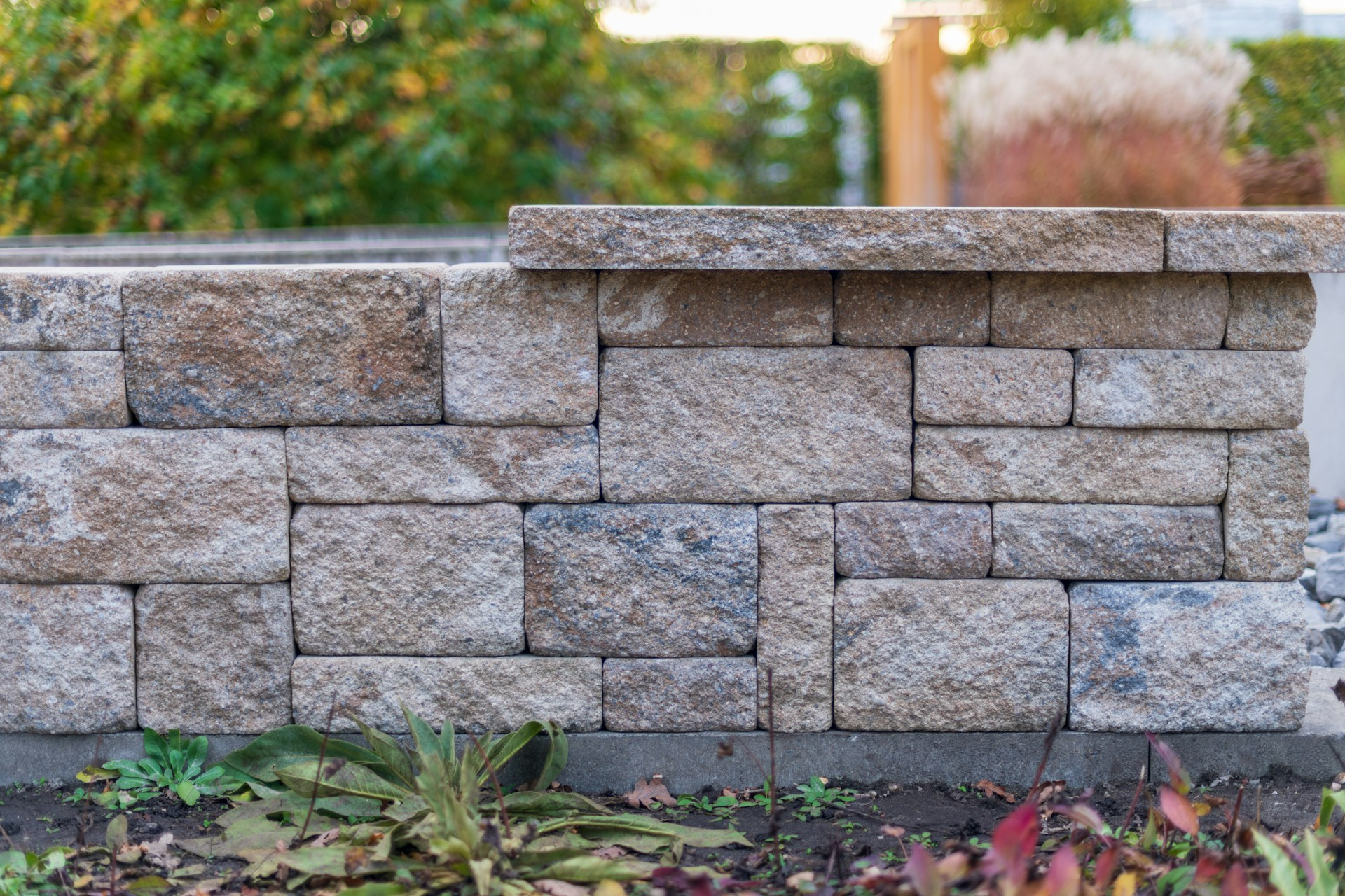 Stone retaining wall with landscaping